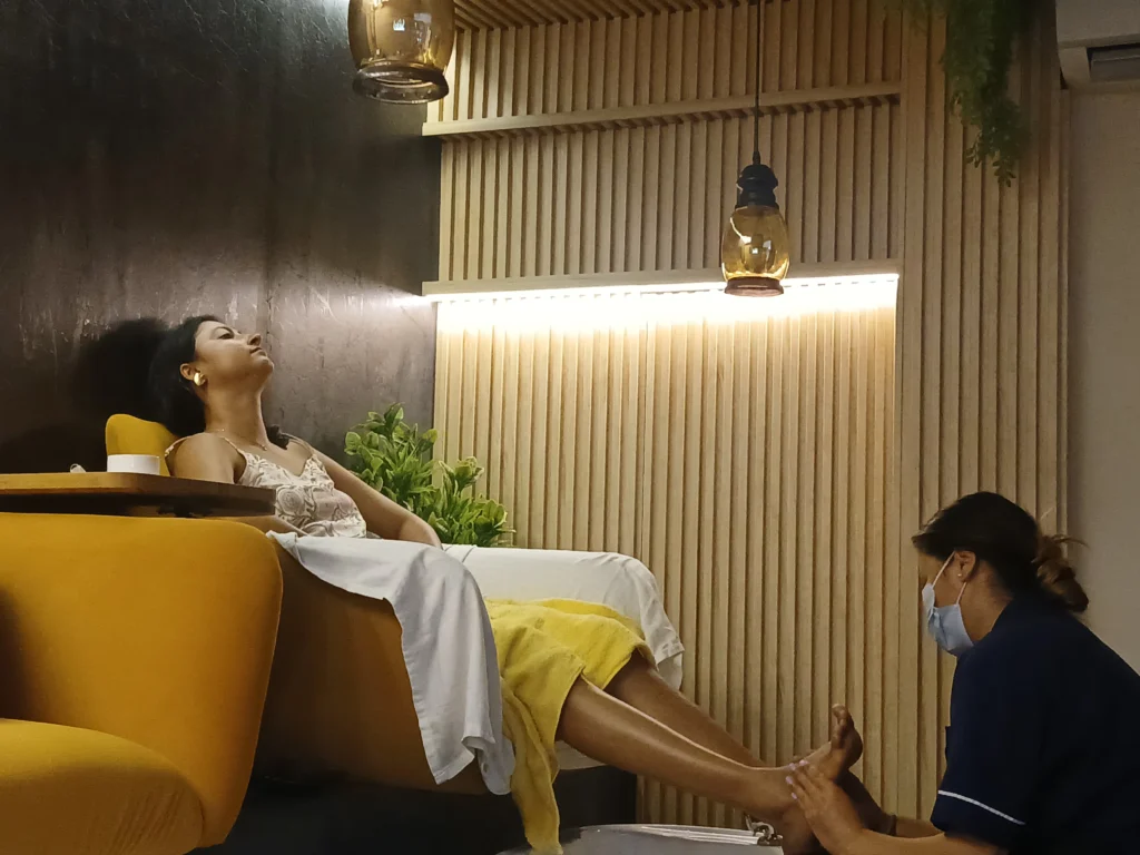 Client enjoying a relaxing pedicure treatment at Subina's Nails Palace in Lalitpur.