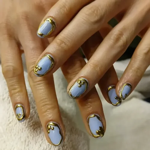 Blue and gold manicure nail art at Subina’s Nails Palace in Jhamsikhel